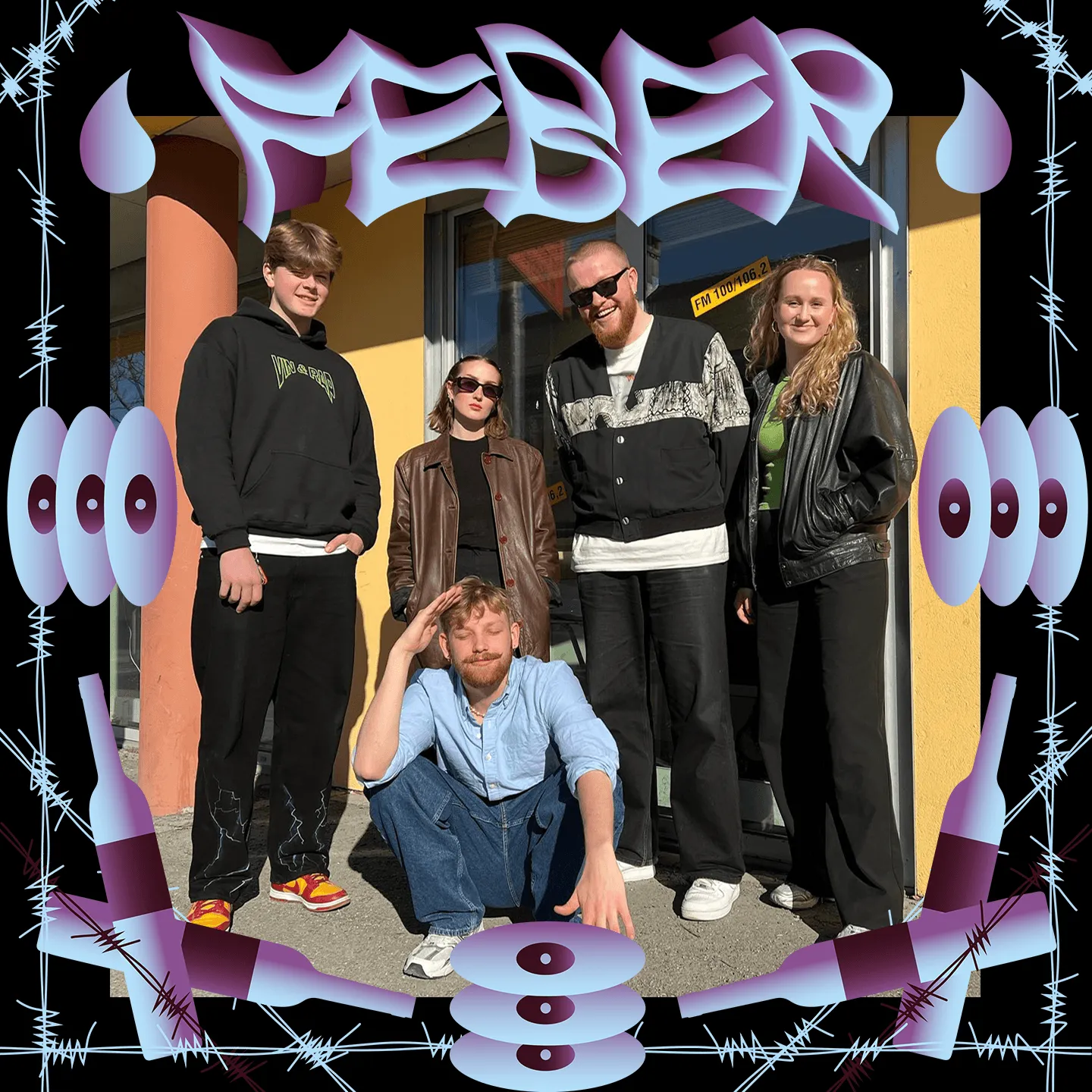 Group of five people posing outside a yellow building, framed by FEBER lettering, barbed wire and bottles