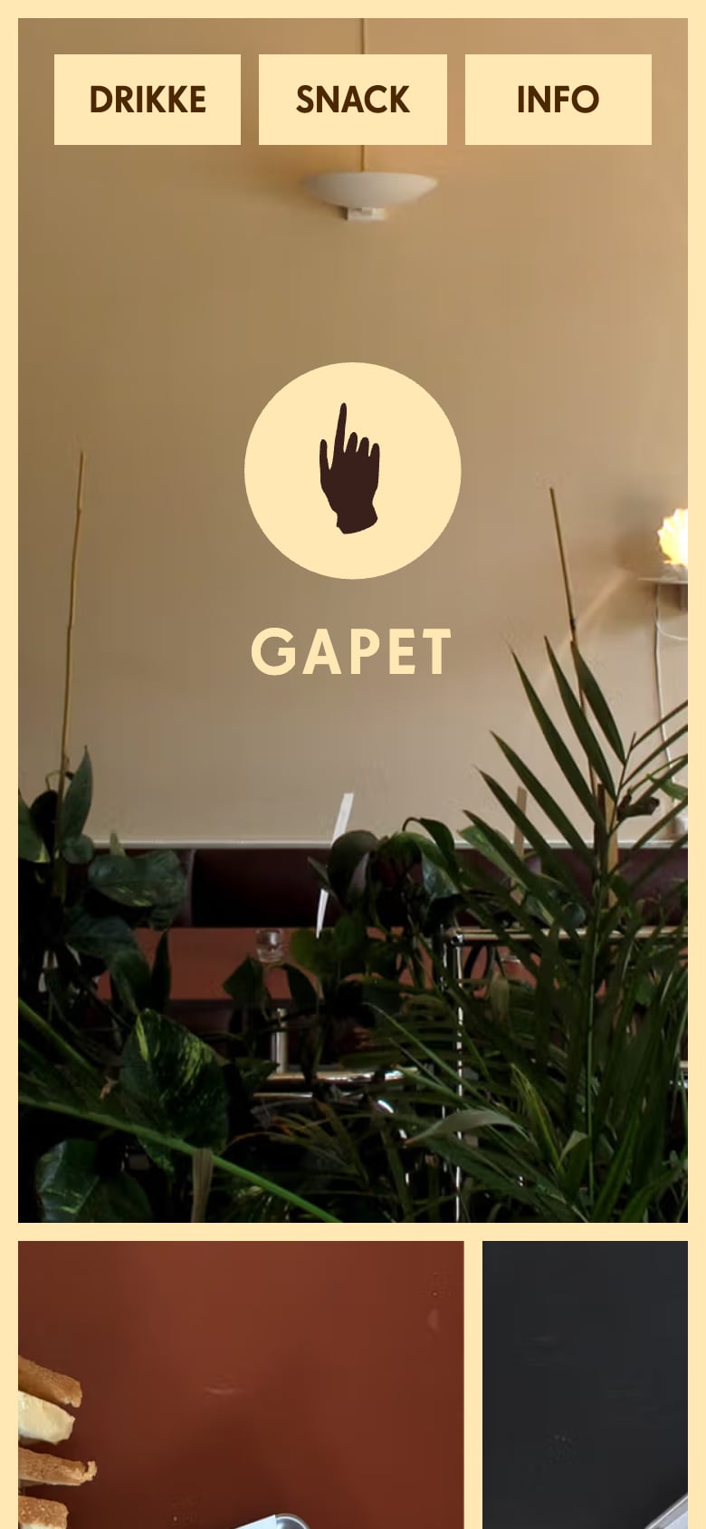GAPET website on a phone: hand logo over a photo of the restaurant